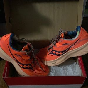 Saucony Ride 15 orange and galaxy running shoes